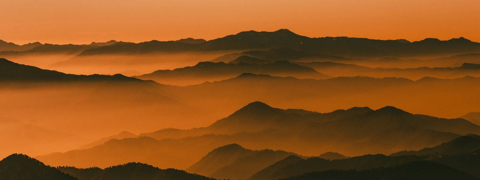 mountains under blue sky during daytime
